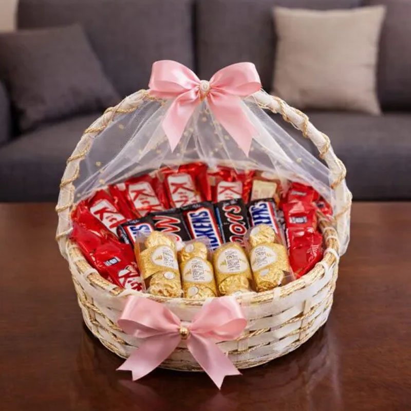 Premium assorted chocolate gift basket with pink ribbon