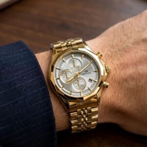 gold watch for men with metallic chain strap worn on wrist