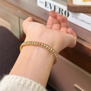 Elegant gold bracelet for women worn on wrist with stylish chain design