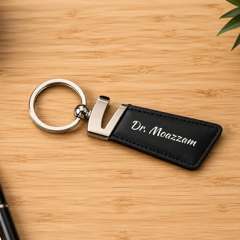 Custom leather keychain with personalized name on a wooden background