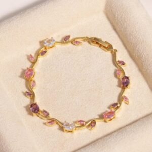 Gold crystal bracelet with pink and purple gemstone detailing