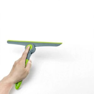 Shower squeegee cleaning a glass shower door