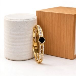 Elegant gold bracelet with black round stone and crystal detailing